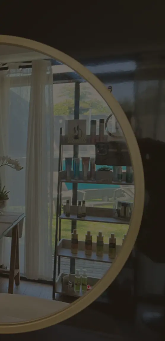 Picture of a mirror with a bathroom in the background at Pause Spa