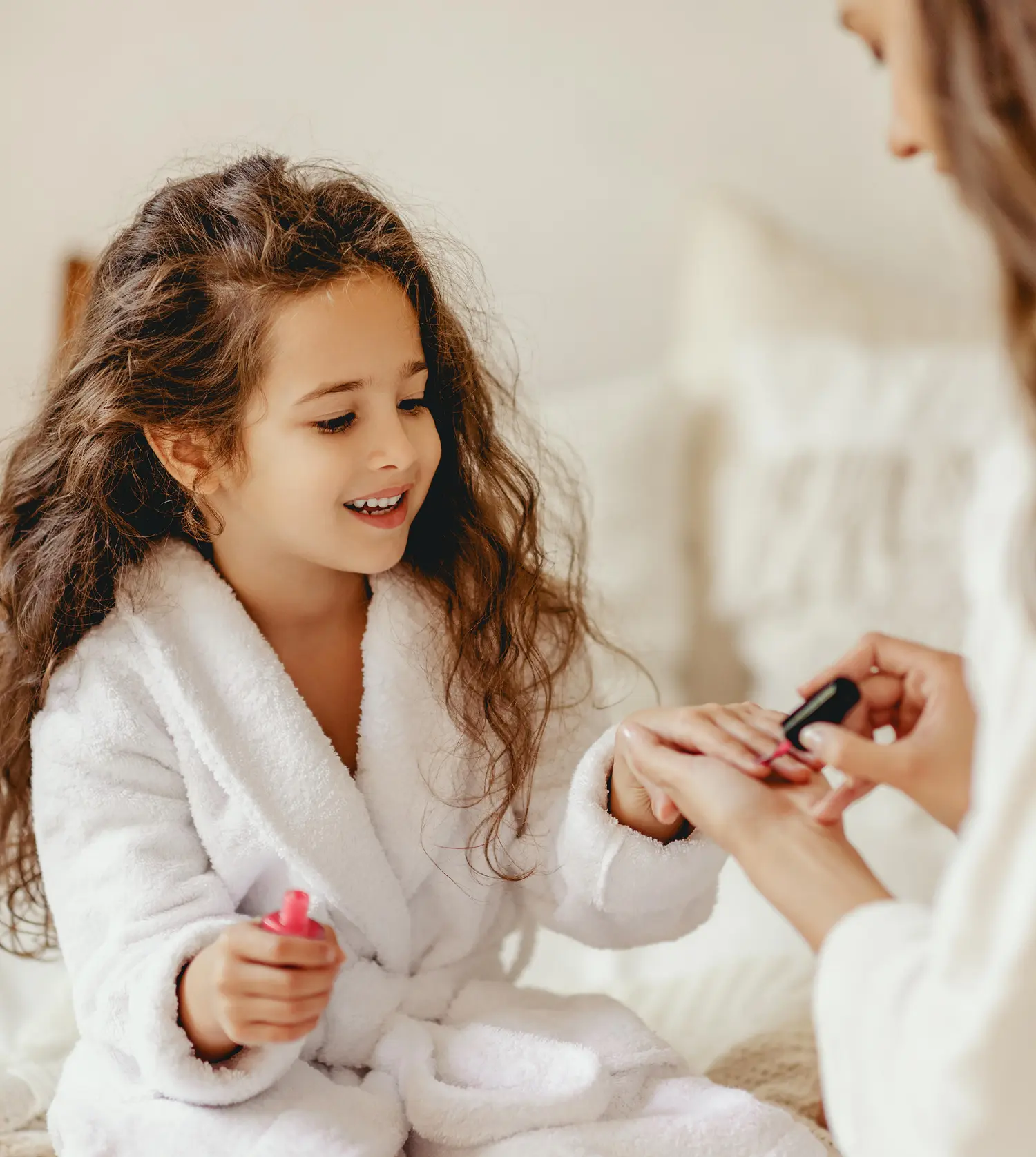 A young girl getting her nails painted during her Kiddies Manicure experience at Pause Spa