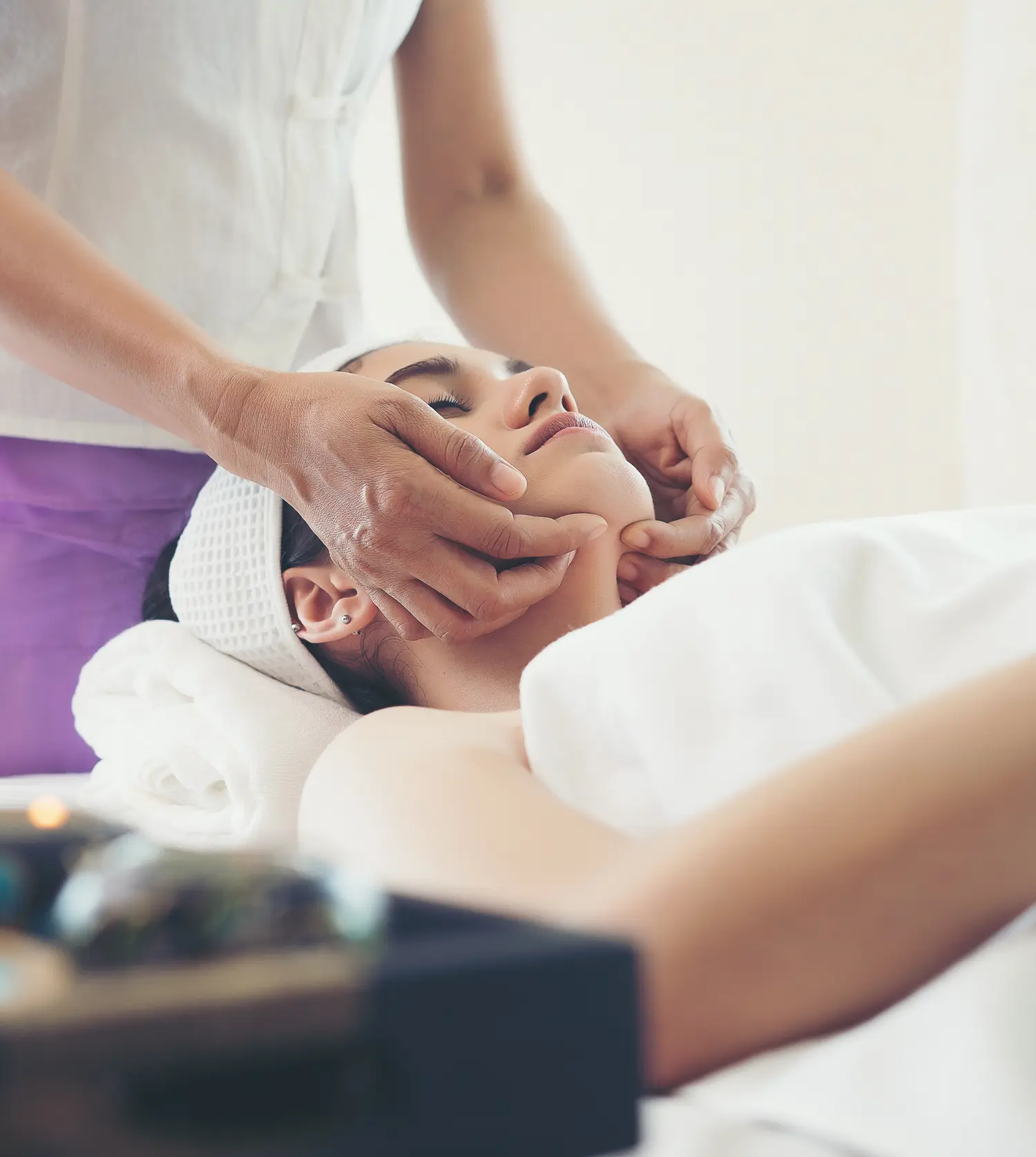 A teenage girl receiving a soothing neck massage during her Kiddies Full-Body Massage experience at Pause Spa
